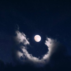 Moon Clouds The moon surrounded by a cresent of clouds