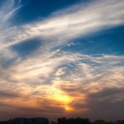 A sunset with whispy clouds